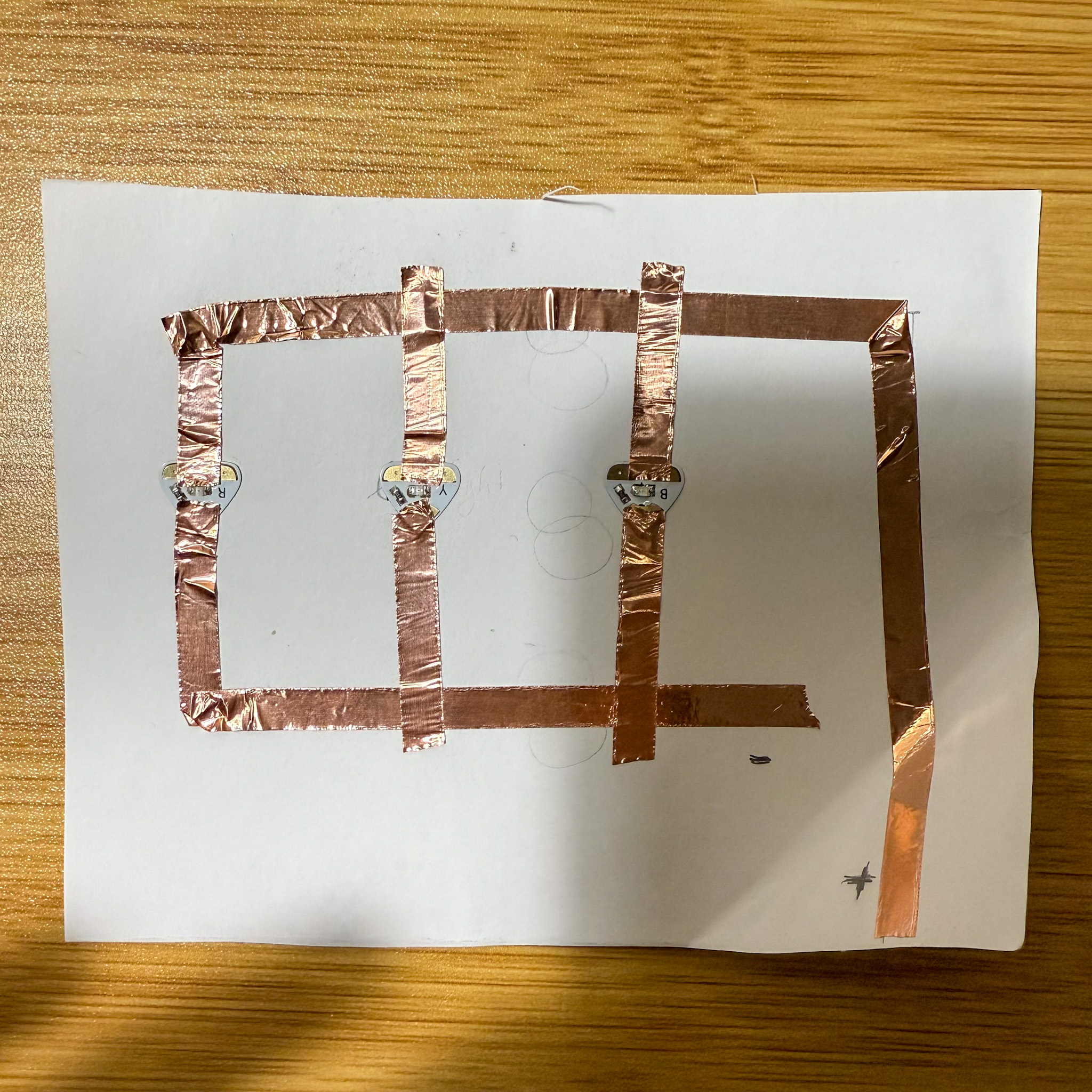 Placing the conductive materials on the circuit. For this circuit, I used conductive tapes.