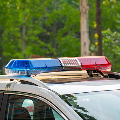 The loud, fluctuating wail of a police siren in downtown Toronto.